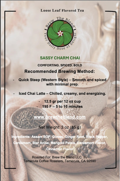 A square product information card for Sassy Charm Chai loose leaf flavored tea by Brew The Blend LLC. The card features a warm-toned background photo of tea ingredients and a cup, with black text detailing brewing methods, ingredients, and the website www.